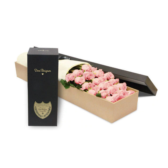 A box of luxury Ecuadorian long-stemmed pink roses with a bottle of Dom Perignon
