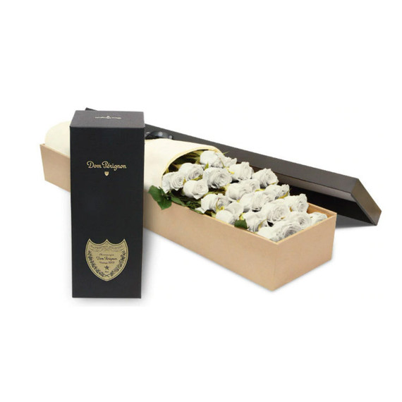 A box of luxury Ecuadorian long-stemmed white roses with a bottle of Dom Perignon